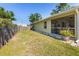 Screened patio and fenced yard offers a private outdoor experience at 1010 Tropical Dr, Bradenton, FL 34208