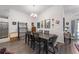 Formal dining room with stylish chandelier, seating for six, and hardwood flooring at 1010 Tropical Dr, Bradenton, FL 34208