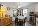 Bright dining area with natural lighting and hardwood floors, perfect for Gathering meals at 1010 Tropical Dr, Bradenton, FL 34208