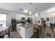 Beautiful kitchen with stainless appliances, granite counters, and island with bar stool seating at 1010 Tropical Dr, Bradenton, FL 34208