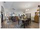 Open floor plan with living room, dining room, hardwood flooring, and lots of natural light at 1010 Tropical Dr, Bradenton, FL 34208