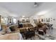 Wide open living room featuring hardwood floors and neutral paint and is adjacent to both kitchen and dining at 1010 Tropical Dr, Bradenton, FL 34208