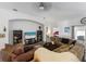 Comfortable living room with plenty of seating, a ceiling fan, and neutral paint at 1010 Tropical Dr, Bradenton, FL 34208