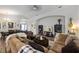 Open concept living room that flows into the dining area with hardwood floors and neutral paint at 1010 Tropical Dr, Bradenton, FL 34208