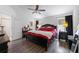 Spacious main bedroom features hardwood flooring, ceiling fan, and dresser at 1010 Tropical Dr, Bradenton, FL 34208