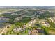 Drone shot captures the scenic neighborhood with its winding streets, ponds, and lush greenery at 1034 Buttercup Gln, Bradenton, FL 34212