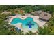 Community pool featuring a water slide, splash pad, hot tub and ample seating areas at 1034 Buttercup Gln, Bradenton, FL 34212