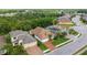 Exterior elevation showing brick driveway and lush landscaping of this charming single-story home at 1034 Buttercup Gln, Bradenton, FL 34212
