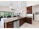 Open kitchen featuring stainless steel appliances, granite countertops, and seamless flow to the outdoor living space at 1034 Buttercup Gln, Bradenton, FL 34212