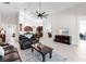 Spacious living room featuring a ceiling fan, high ceilings, and tile flooring at 1034 Buttercup Gln, Bradenton, FL 34212