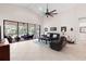 Bright living room with tile flooring, comfortable seating, and views of the lanai at 1034 Buttercup Gln, Bradenton, FL 34212
