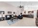 Open concept living area with comfortable seating and a kitchen island with bar stools at 1034 Buttercup Gln, Bradenton, FL 34212
