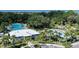 A view of community amenities including a pool, splashpad, and clubhouse at 10464 Ladybug Cv, Parrish, FL 34219