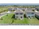 Aerial view showcasing the spacious backyards and community pond in Summerwoods at 10464 Ladybug Cv, Parrish, FL 34219