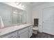Clean bathroom with a modern vanity, framed mirror, and glass-enclosed shower at 10464 Ladybug Cv, Parrish, FL 34219