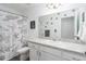 Bathroom with vanity, mirror, dinosaur shower curtain, and white walls at 10464 Ladybug Cv, Parrish, FL 34219