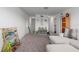 Upstairs bonus room with carpet, a comfy couch, and decor for children to enjoy at 10464 Ladybug Cv, Parrish, FL 34219