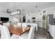 Open floor plan featuring a dining area, kitchen, and living room with stylish decor at 10464 Ladybug Cv, Parrish, FL 34219