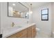 Modern bathroom featuring double vanity, modern lighting, and updated fixtures at 1052 Concord W Dr, Dunedin, FL 34698