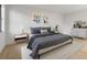 Stylishly decorated bedroom with a queen bed, artwork, and modern decor at 1052 Concord W Dr, Dunedin, FL 34698