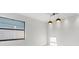 Minimalist dining room design featuring a window and modern lighting at 1052 Concord W Dr, Dunedin, FL 34698