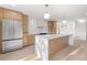 Open concept kitchen features stainless steel appliances, countertops, and custom cabinets at 1052 Concord W Dr, Dunedin, FL 34698