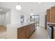 Modern kitchen featuring an island, stainless appliances, sleek countertops, and ample cabinet space at 1052 Concord W Dr, Dunedin, FL 34698