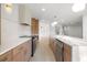 Spacious kitchen featuring modern appliances, countertops, cabinets and a view to the living room at 1052 Concord W Dr, Dunedin, FL 34698