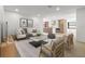 Bright and airy living room featuring modern decor and an open layout to the kitchen at 1052 Concord W Dr, Dunedin, FL 34698