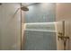 Detailed shot of the shower showcasing modern tiles, a built-in shelf, and a sleek, rainfall shower head at 1052 Concord W Dr, Dunedin, FL 34698