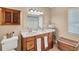 Bathroom featuring a double vanity, framed mirror, and coordinating fixtures at 1104 76Th Nw St, Bradenton, FL 34209