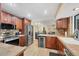 This spacious kitchen is equipped with stainless steel appliances, wood cabinetry, and tile countertops at 1104 76Th Nw St, Bradenton, FL 34209