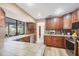 This spacious kitchen is equipped with stainless steel appliances, wood cabinetry, and tile countertops at 1104 76Th Nw St, Bradenton, FL 34209