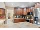 This spacious kitchen is equipped with stainless steel appliances, wood cabinetry, and tile countertops at 1104 76Th Nw St, Bradenton, FL 34209