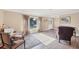 Inviting living room featuring wood-look floors, a large window, and cozy seating arrangements at 1104 76Th Nw St, Bradenton, FL 34209