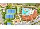 Overhead view of community clubhouse with pool, tennis courts, playground, and other amenities at 11959 Tapestry Ln, Venice, FL 34293