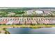 Beautiful aerial view of waterfront homes in planned community with mature trees and lush landscaping at 11959 Tapestry Ln, Venice, FL 34293