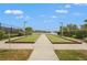 Well-maintained bocce ball court with landscaped surroundings, offering a relaxing outdoor recreation space at 11959 Tapestry Ln, Venice, FL 34293
