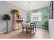 Charming dining room featuring a round table, decorative chandelier, and unique nautical themed wall decor at 11959 Tapestry Ln, Venice, FL 34293