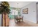 Bright dining room featuring coastal decor, a stylish chandelier, and tiled flooring at 11959 Tapestry Ln, Venice, FL 34293