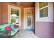 Inviting entryway featuring a decorative glass door, sidelight windows, and a comfortable seating area at 11959 Tapestry Ln, Venice, FL 34293