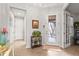 Inviting entryway with a decorative glass door, tiled floor, and stylish accents at 11959 Tapestry Ln, Venice, FL 34293