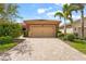 Charming single-story home featuring a paver driveway, a neutral palette and a well-maintained lawn at 11959 Tapestry Ln, Venice, FL 34293