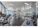 Community gym with treadmills, weights, machines, fan, high ceilings and televisions for entertainment at 11959 Tapestry Ln, Venice, FL 34293