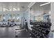 Community gym with weights, machines, fan, high ceilings, television, and updated flooring at 11959 Tapestry Ln, Venice, FL 34293