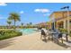 Stunning community pool with ample seating, perfect for lounging and enjoying the Florida sunshine at 11959 Tapestry Ln, Venice, FL 34293