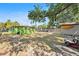 Large green backyard with a shed, lush trees, and room to add a pool or outdoor living space at 1417 14Th E St, Bradenton, FL 34208