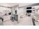 Open floor plan showcasing the kitchen with an island and the living room with modern decor at 1417 14Th E St, Bradenton, FL 34208