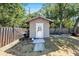 Exterior of shed featuring white door and concrete foundation at 1417 14Th E St, Bradenton, FL 34208