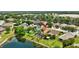 An aerial view of a home with a screened-in pool in a community with mature landscaping at 14315 Tree Swallow Way, Lakewood Ranch, FL 34202